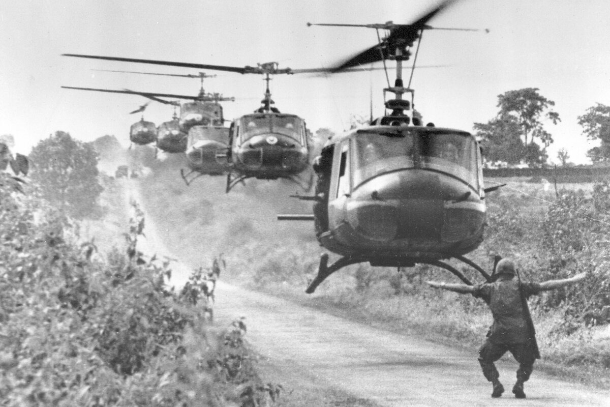 Huey helicopters, carrying U.S. 173rd Airborne troops, settle in for a landing.The unit found friendly Viet Cong. 